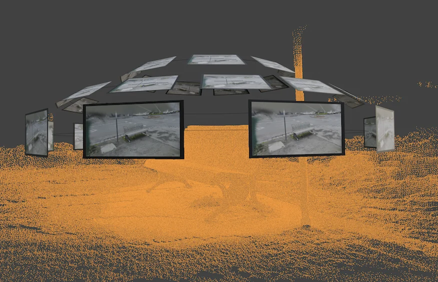 Gaussian splat reconstruction progress showing camera frames and a developing point representation.