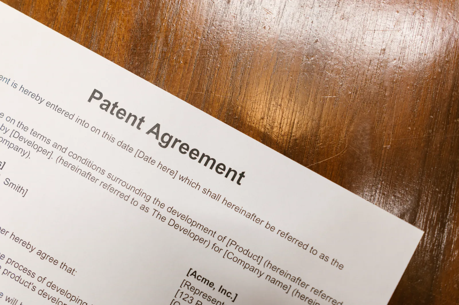 Close-up of a legal agreement document on a desk.